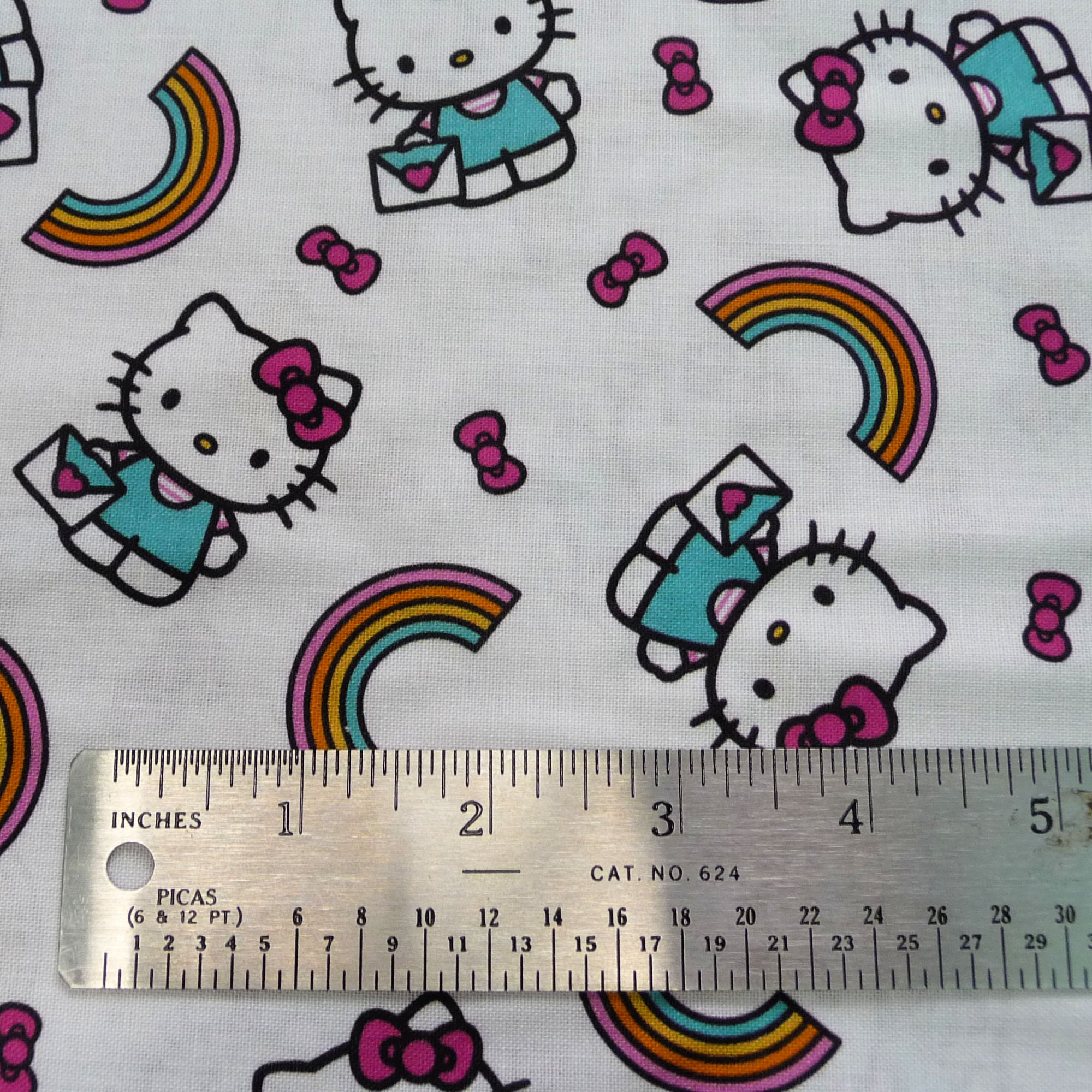 Hello Kitty Fabric by the Yard – Rainbows & Bows Toss on White | Springs Creative